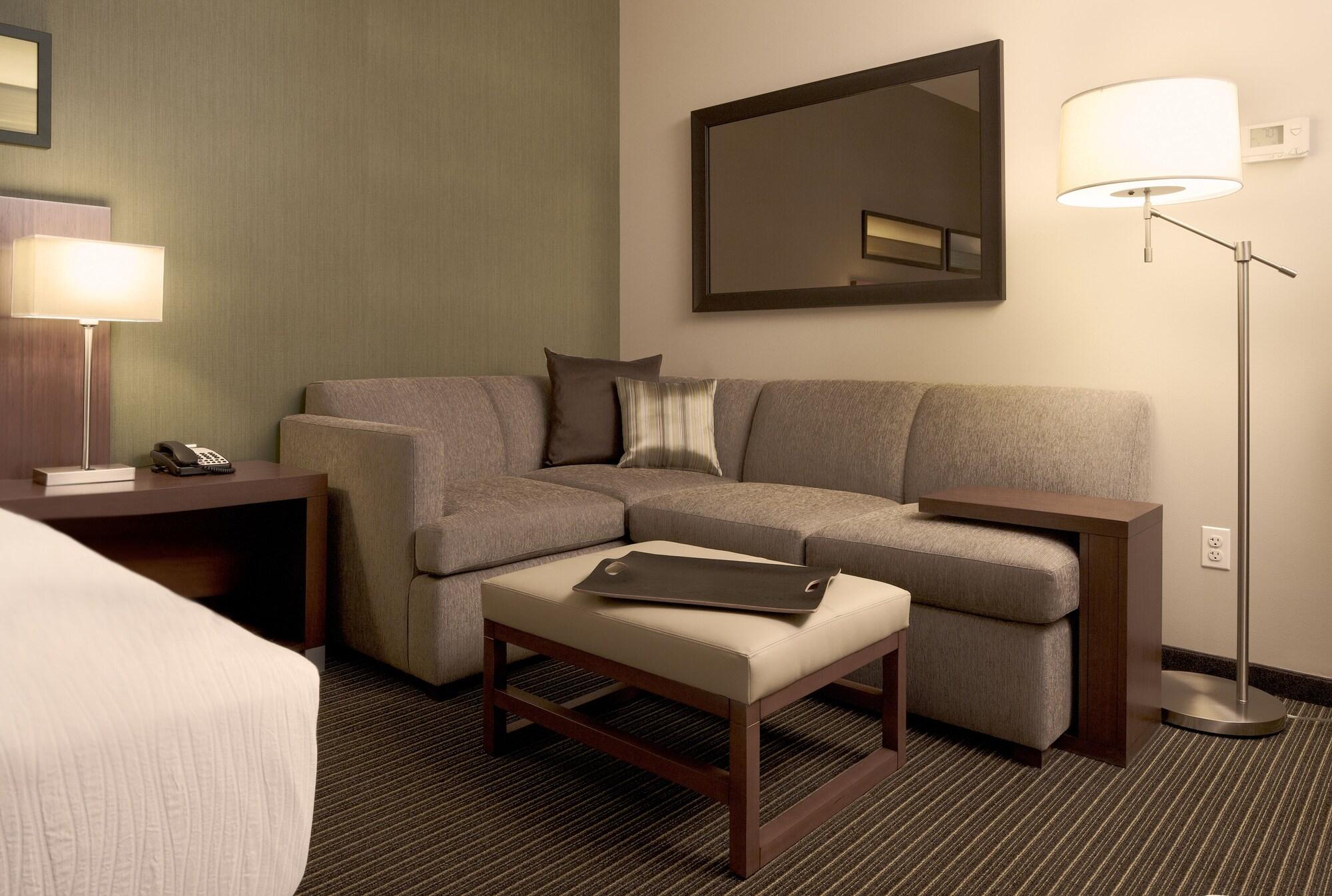 하얏트 플레이스 구르가온 우디오그 비하르 호텔 외부 사진 A living room in a typical hotel room